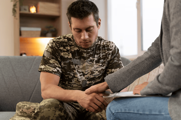 A veteran receiving IV ketamine treatment in a calm clinical setting, symbolizing emotional healing and fast recovery through ketamine therapy for veterans with PTSD.